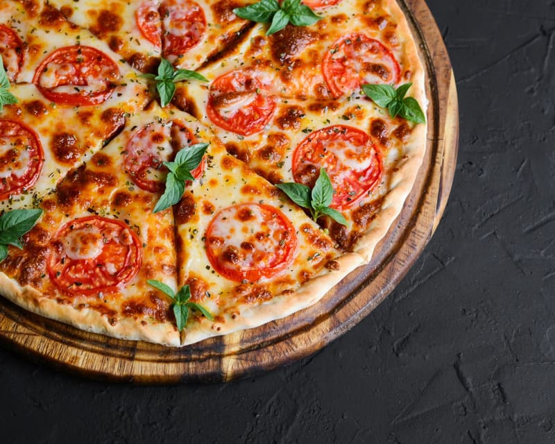 a margherita pizza on a board