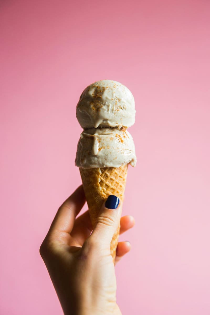 an ice cream cone on pink