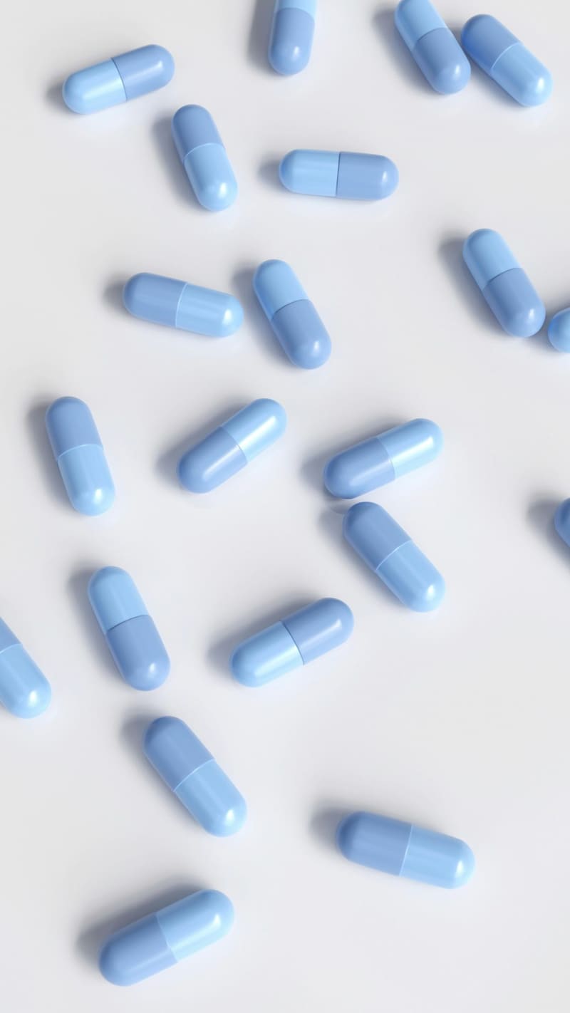 blue capsules on white