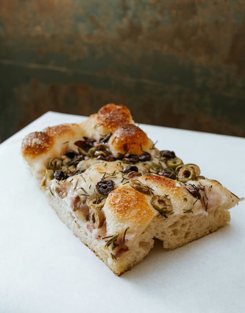 a slice of olive focaccia